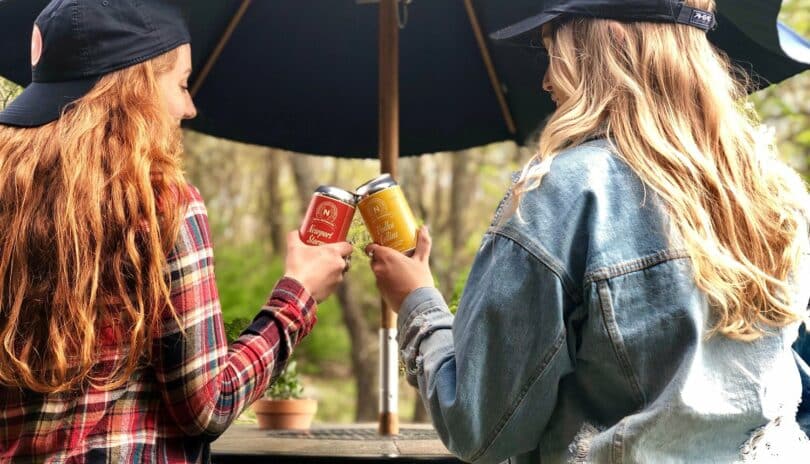 2 girls drinking beer at a brewery in Newport RI